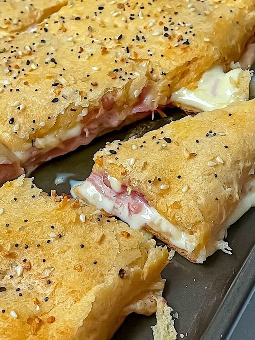 Hot ham and cheese sandwiches, made with crescent roll dough