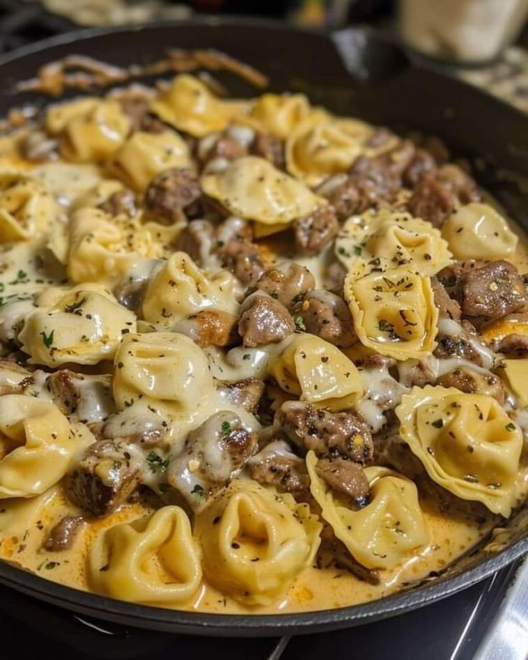 Cheesesteak tortellini in rich provolone sauce