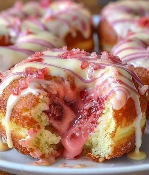 Strawberry-Filled Donuts with Pink and White Glaze